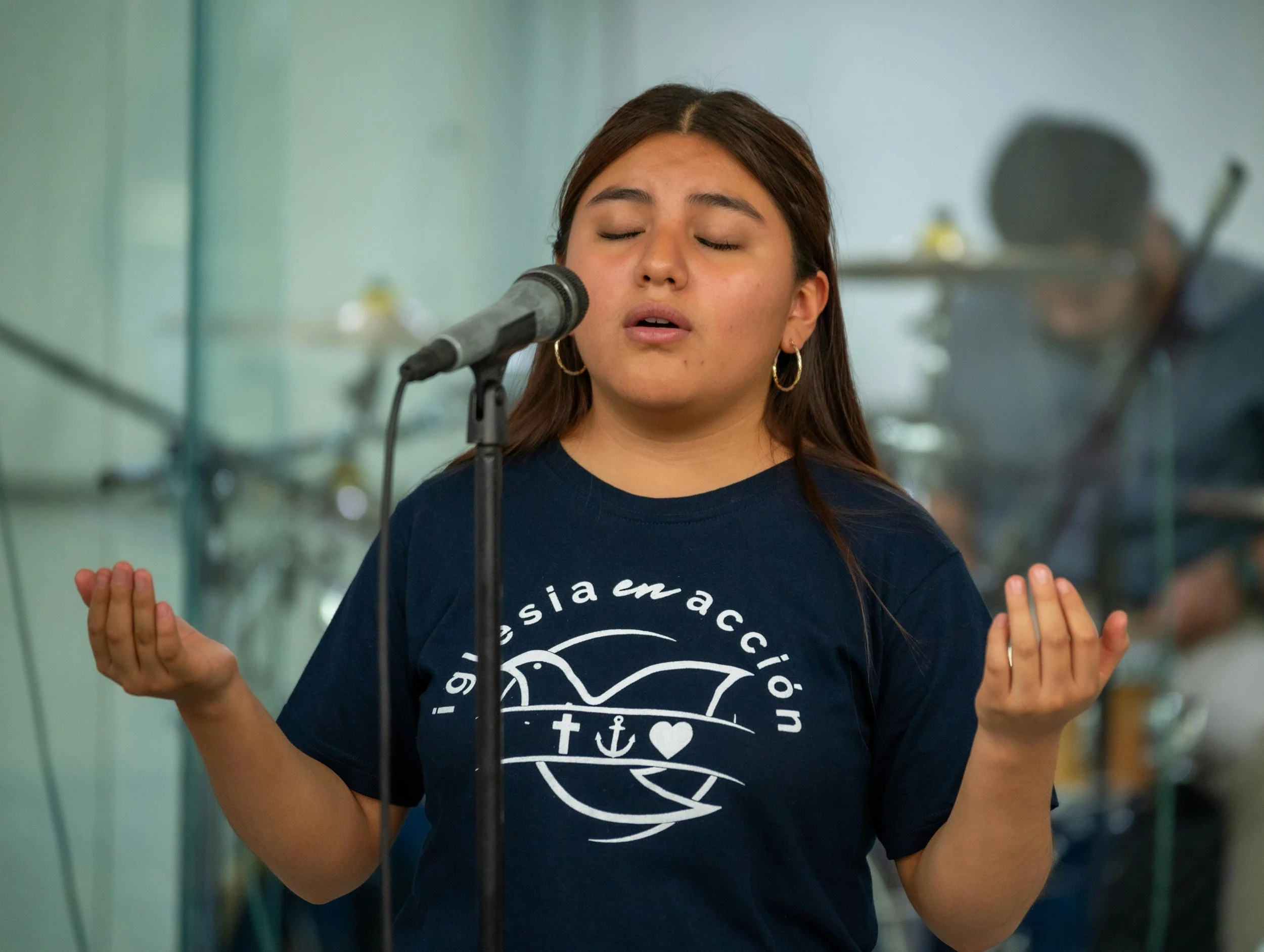 Singer performing into a microphone