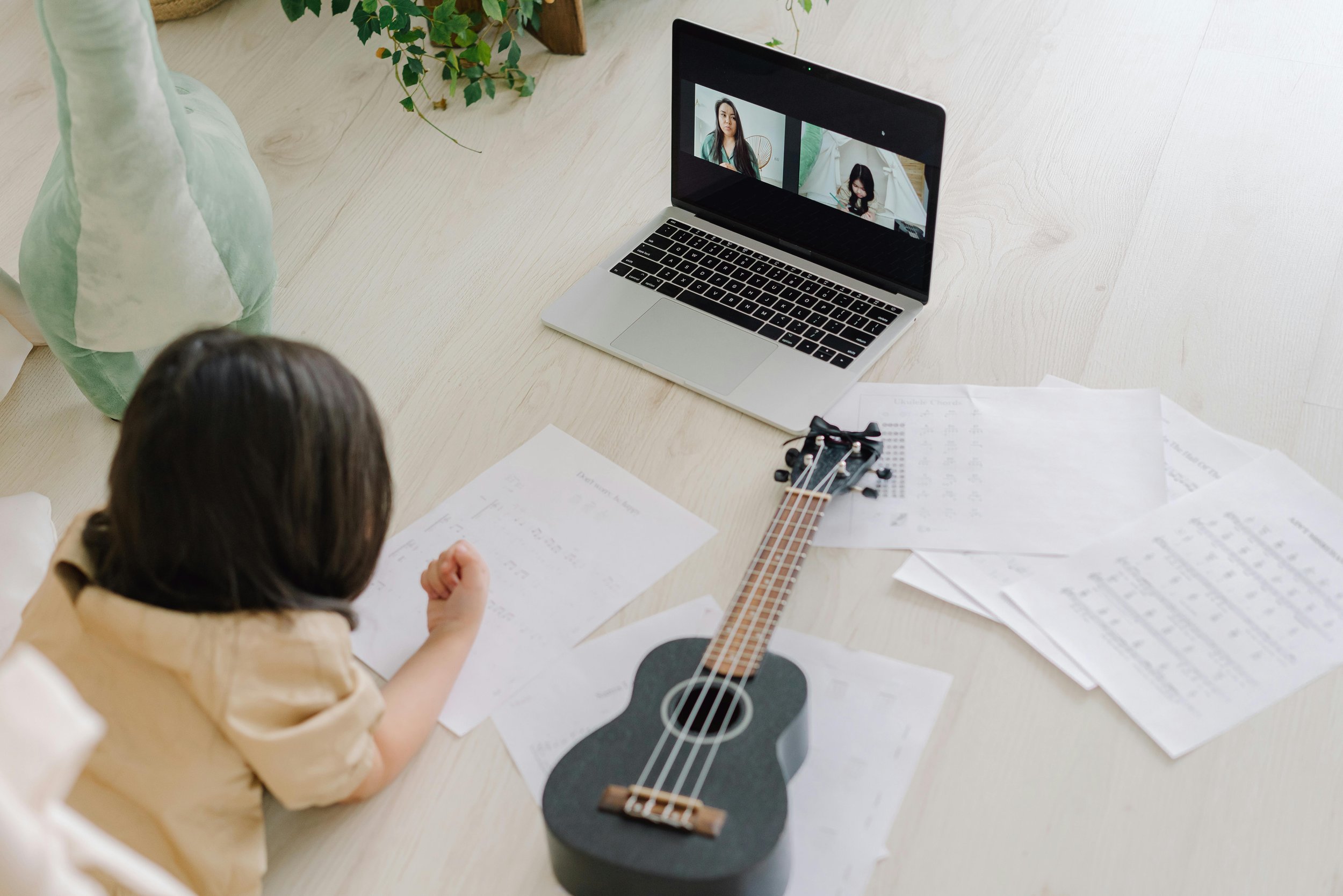 A child participating in a virtual voice lesson